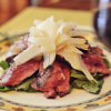 Tagliata di Manzo con Rucola e Grana